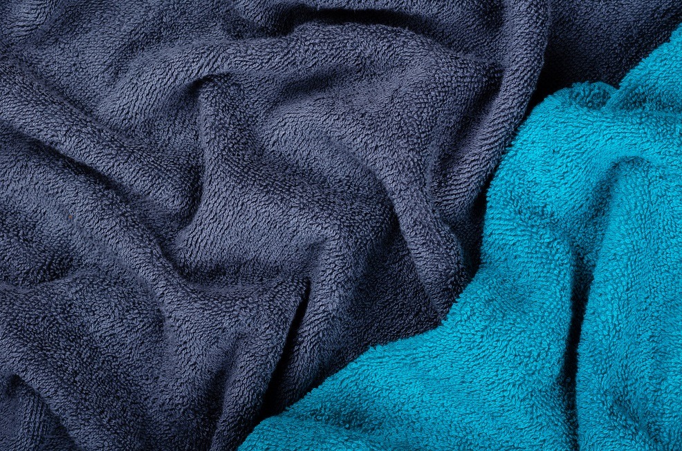 Blue towel fabric texture, top view photo.